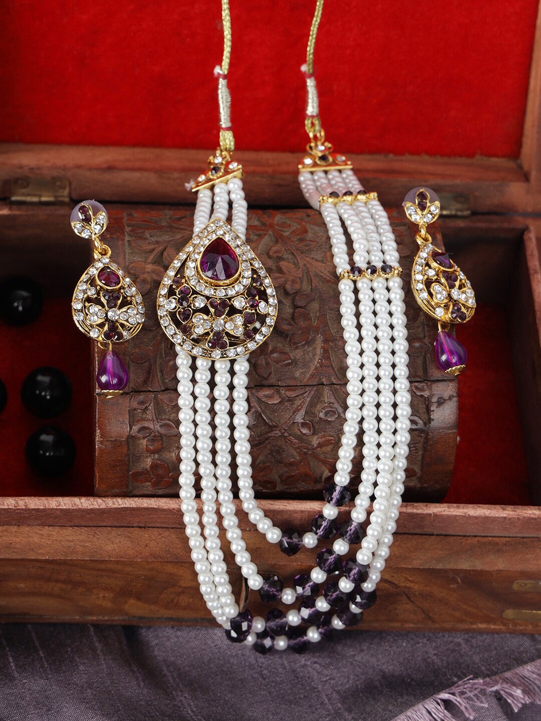 

ANIKAS CREATION Gold-Plated & White Stone Studded Handcrafted Traditional Rajwada Side Broch Multi-Strand Jewellery Set
