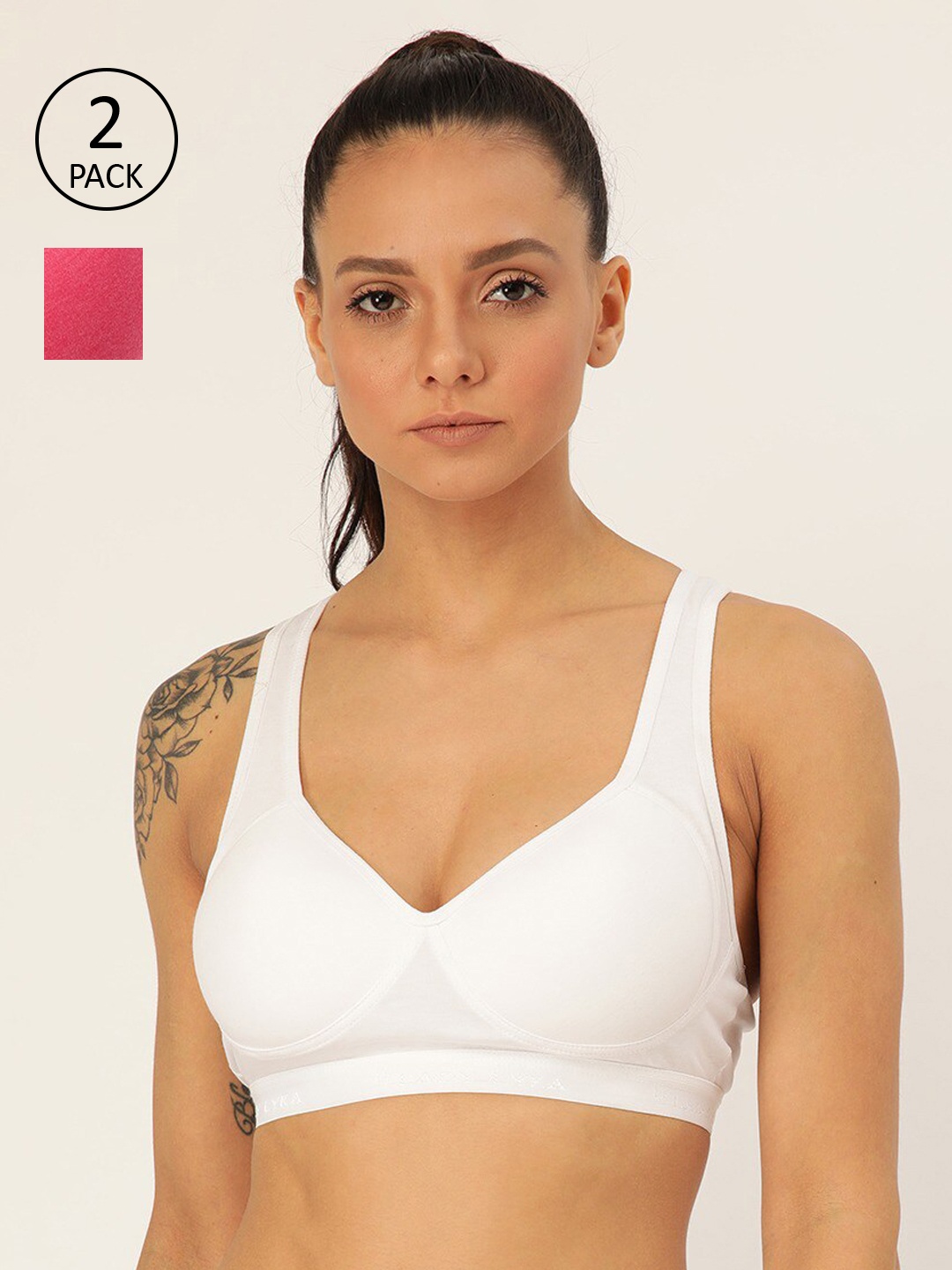 

Lady Lyka White & Fuchsia Solid Non-Wired Lightly Padded Workout Bra PROVOGUE