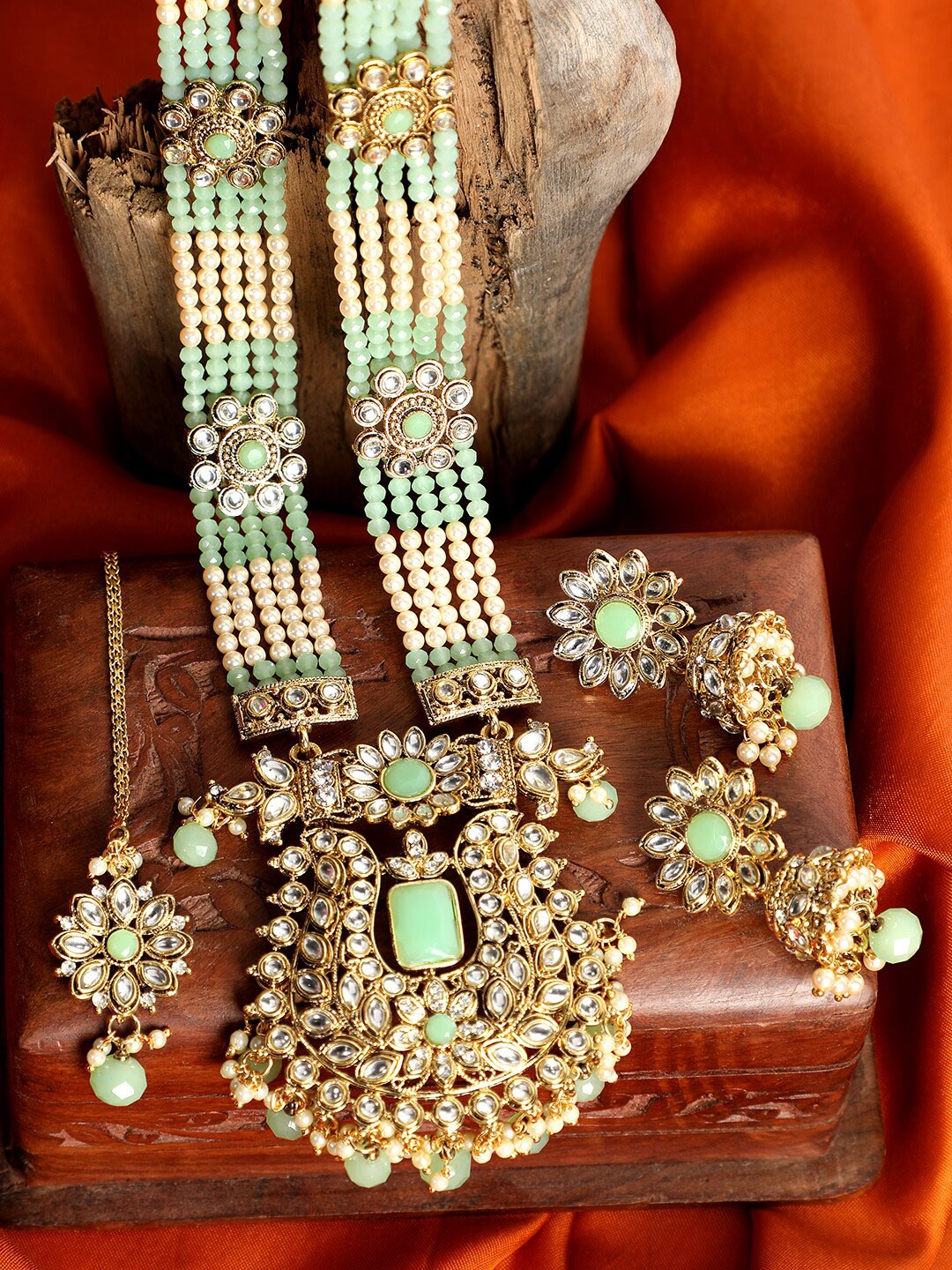

ANIKAS CREATION Gold-Plated Sea Green & Off-White Stone studded & Pearl Beaded Handcrafted Jewellery Set