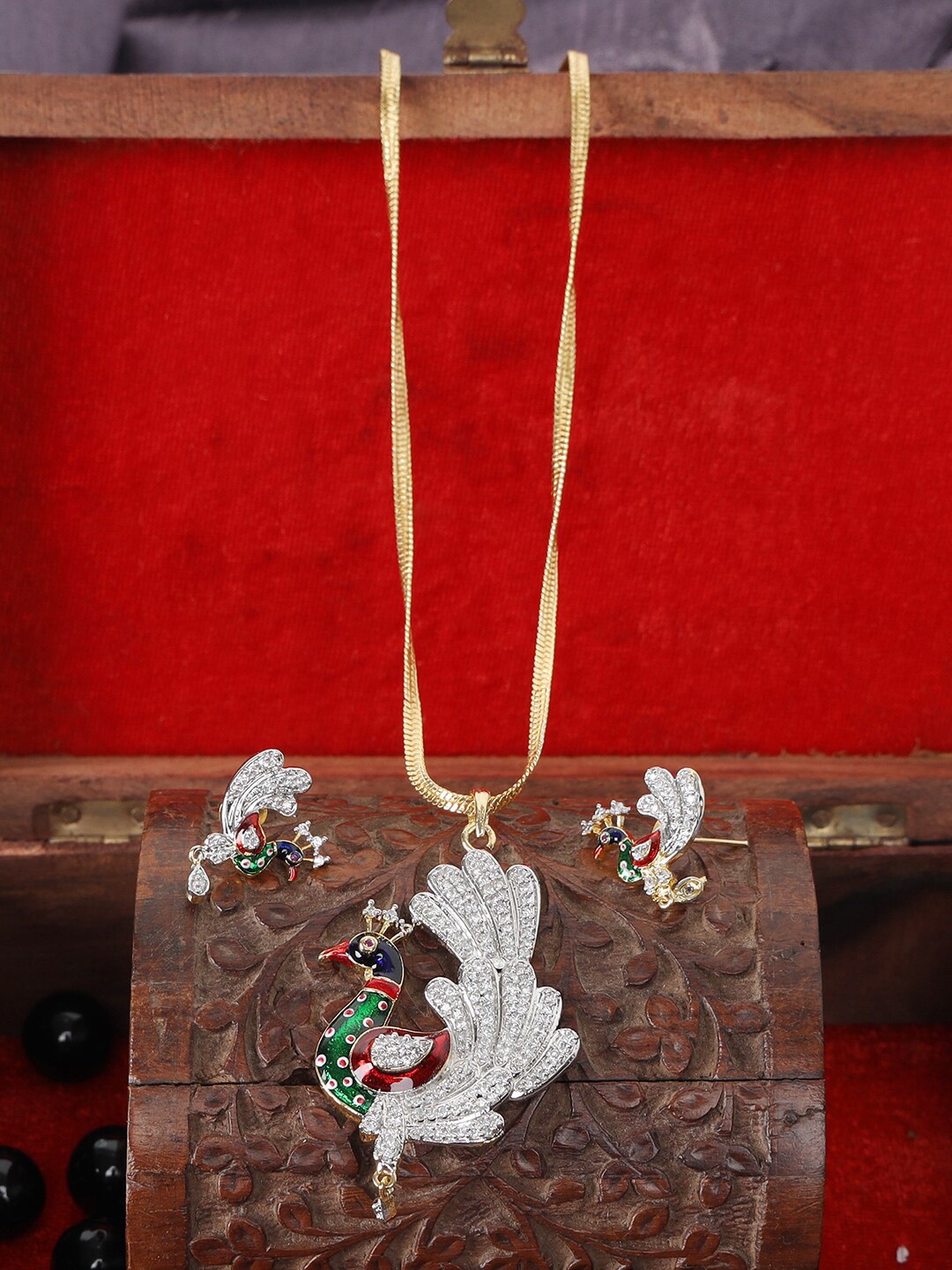 

ANIKAS CREATION Gold-Plated White & Green Stone-Studded Peacock-Shaped Handcrafted Jewellery Set