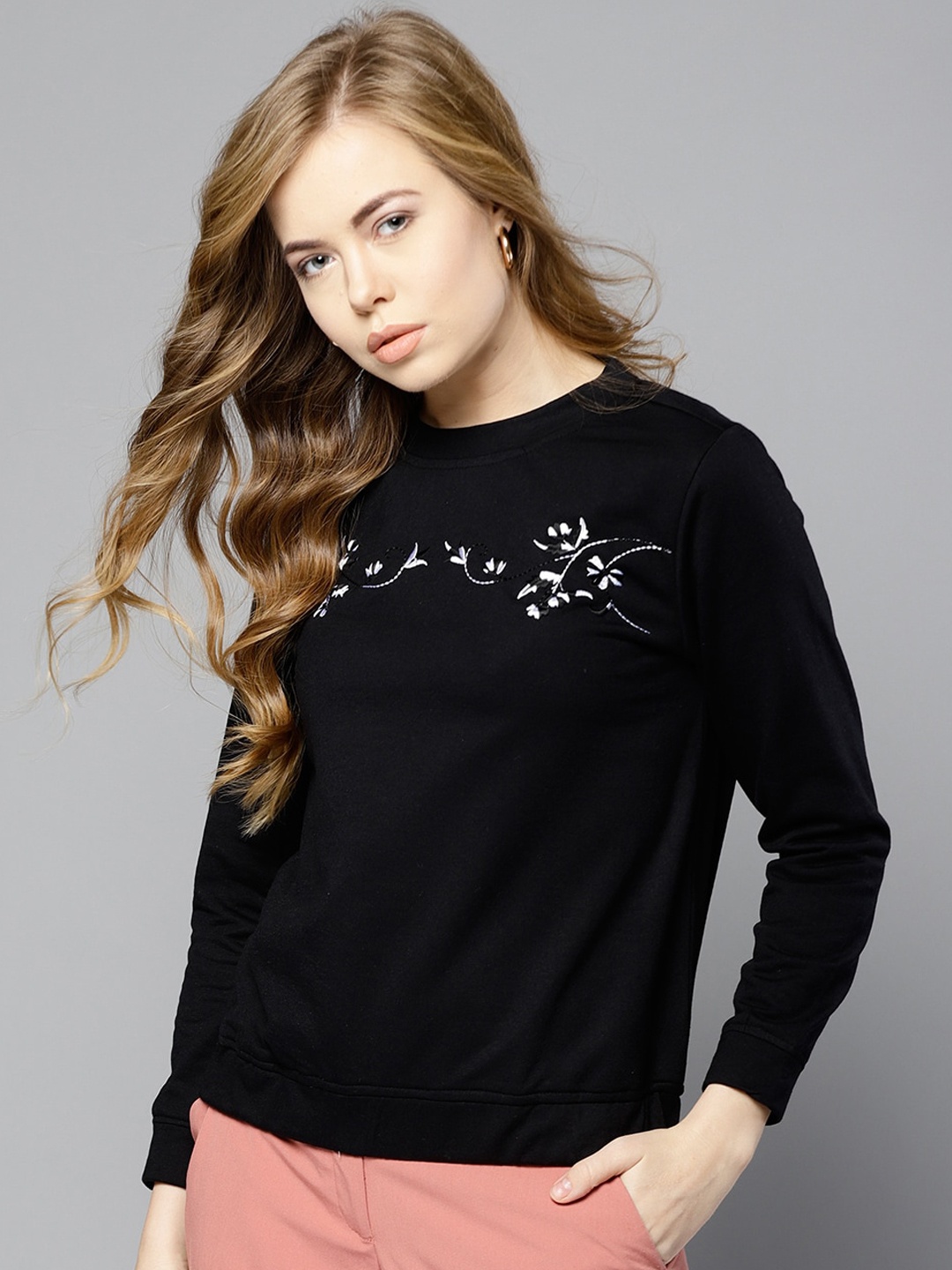 

Carlton London Women Black Solid Sweatshirt