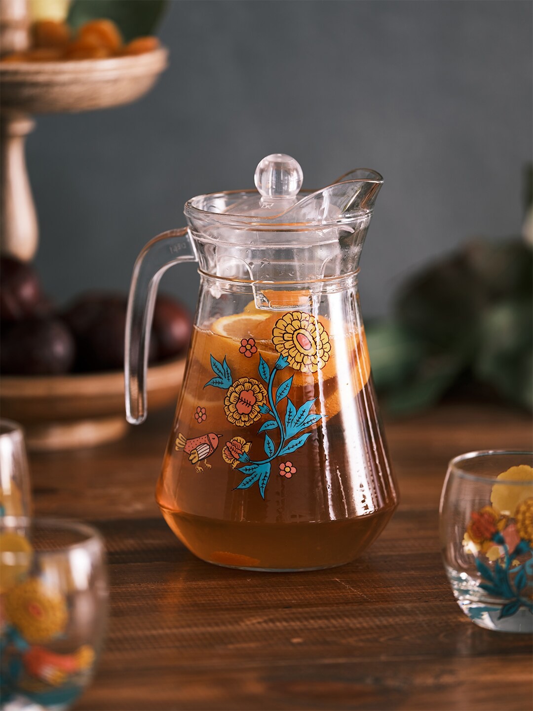 

Chumbak Printed Glass Jug Pitcher With Lid 1300 ml, Transparent