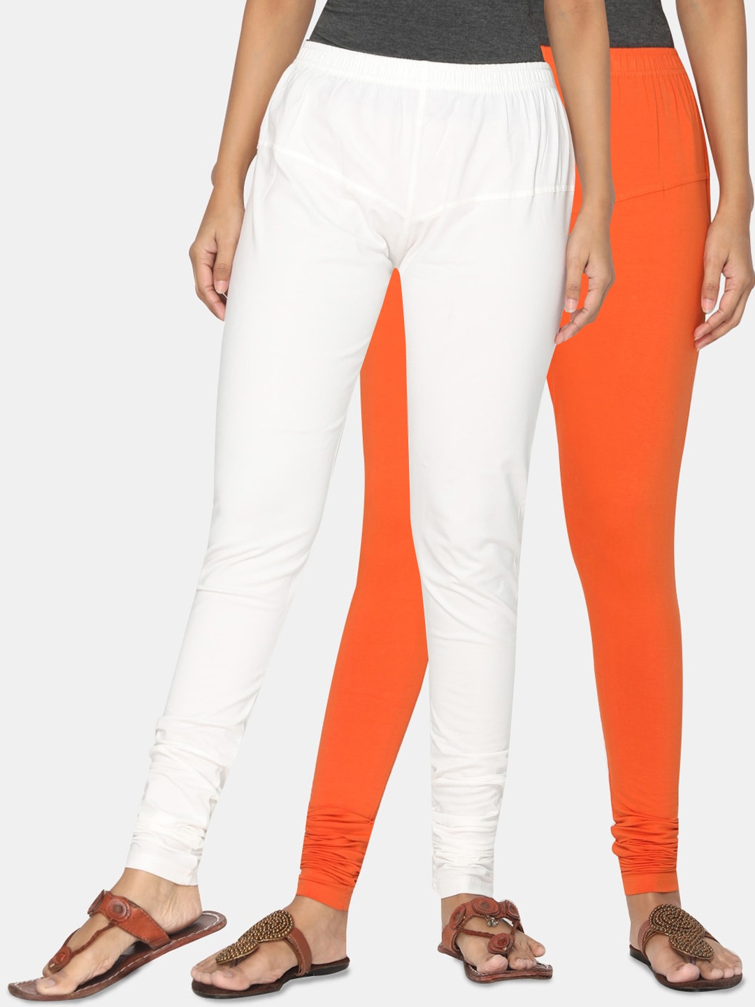 

TSG Bliss Women Pack Of 2 Off-White & Orange Solid Churidar-Length Leggings