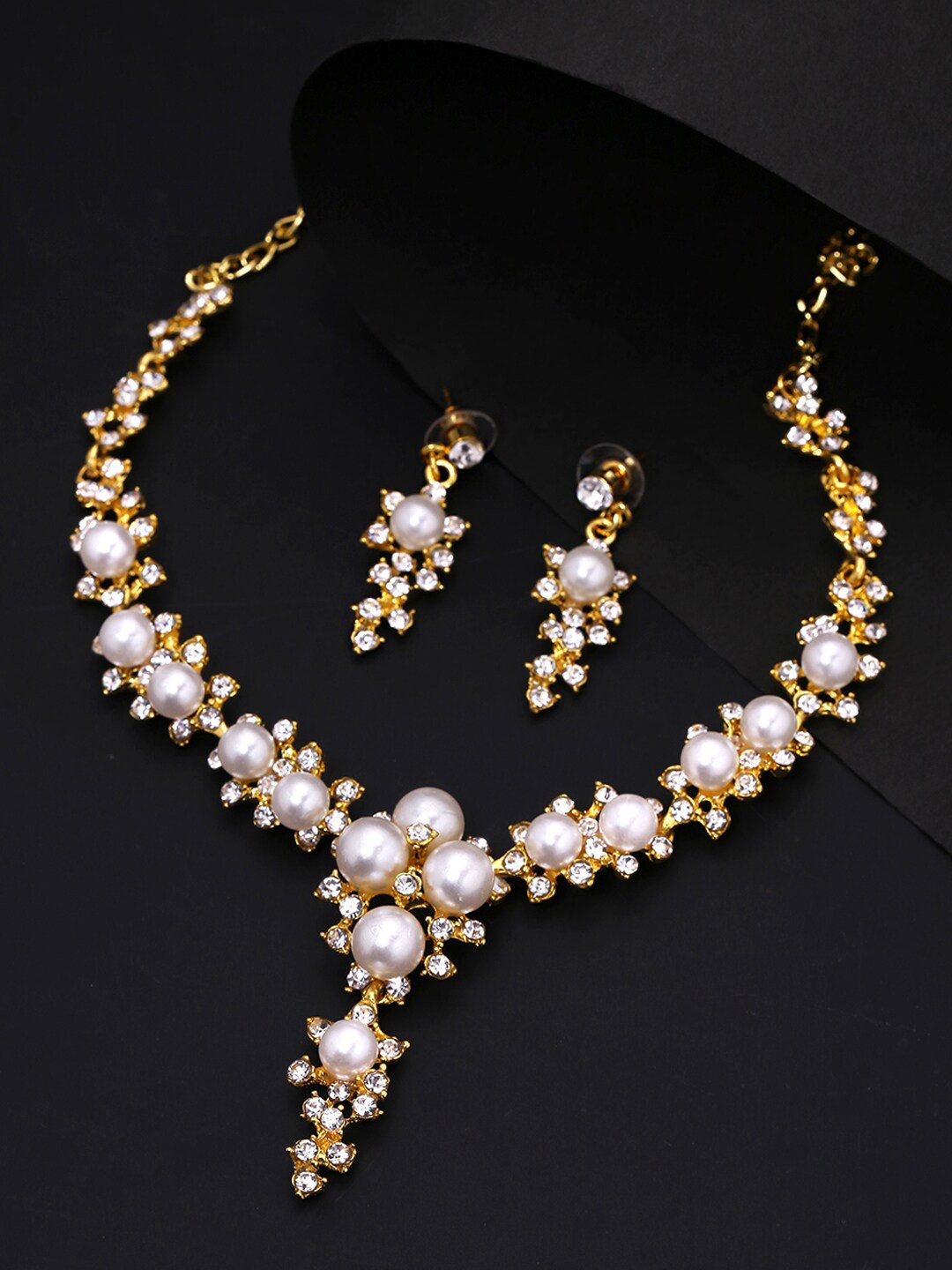 

Yellow Chimes Gold-Plated & White Stone & Pearl Studded Jewellery Set