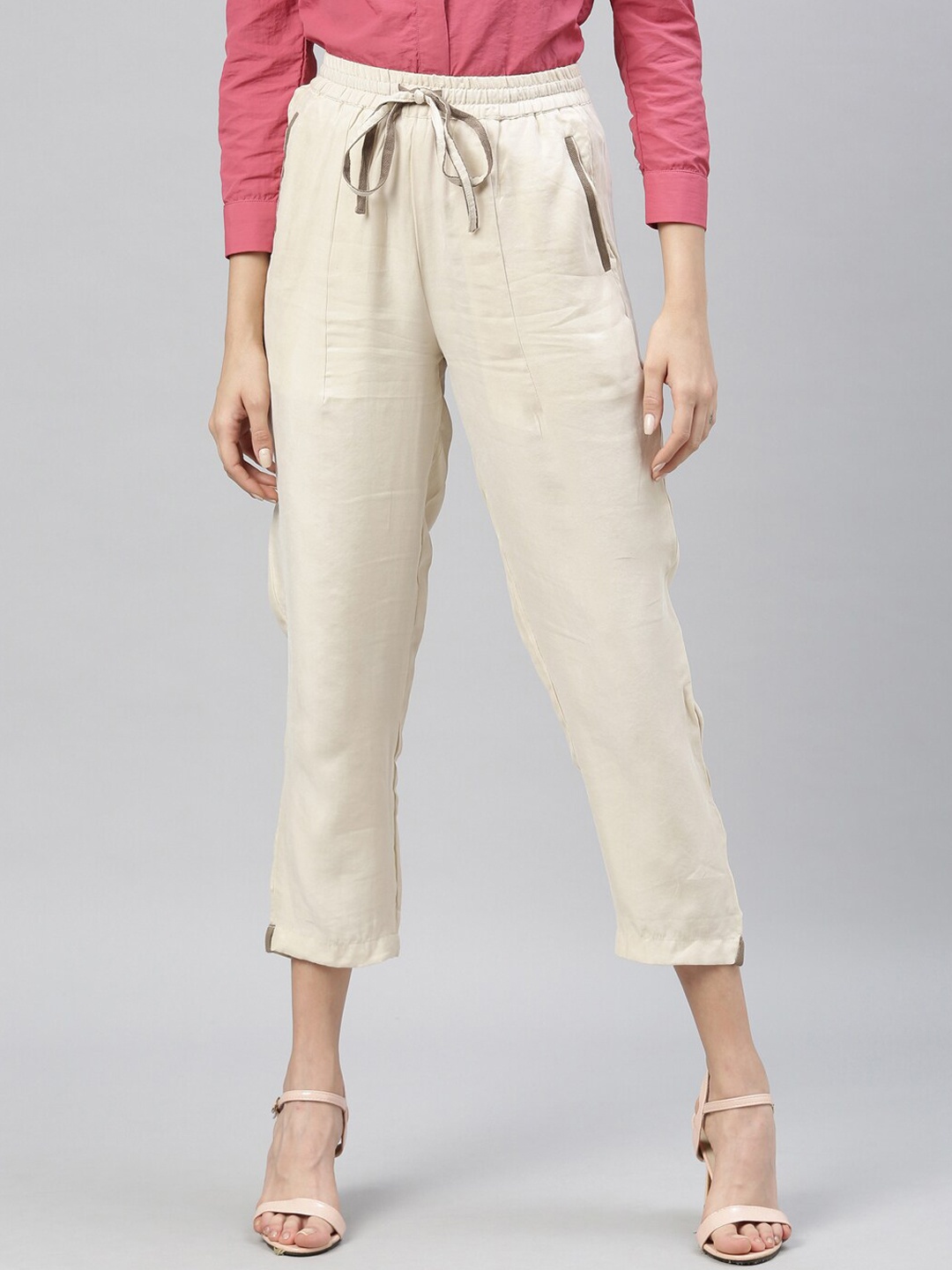 

RAREISM Women Beige Tapered Fit Solid Cropped Peg Trousers