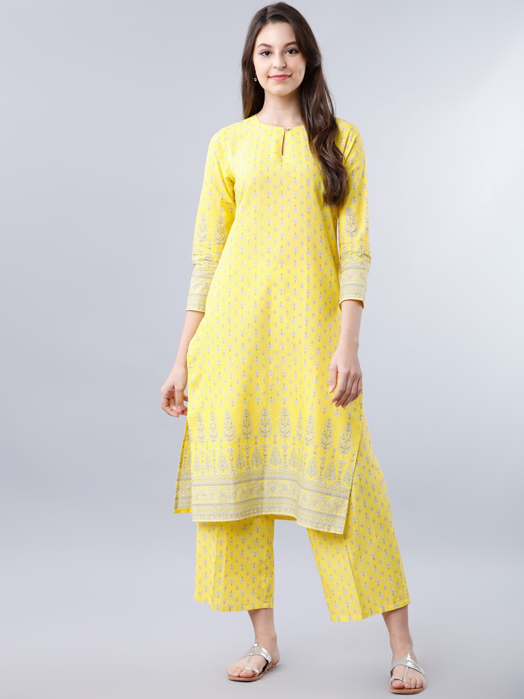

Vishudh Women Yellow & Off-White Printed Kurti with Trousers