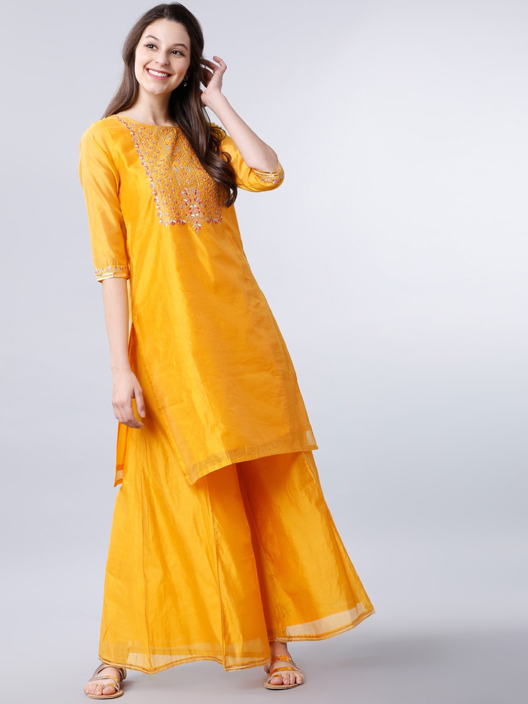 

Vishudh Women Mustard Yellow Floral Yoke Design Kurta with Skirt