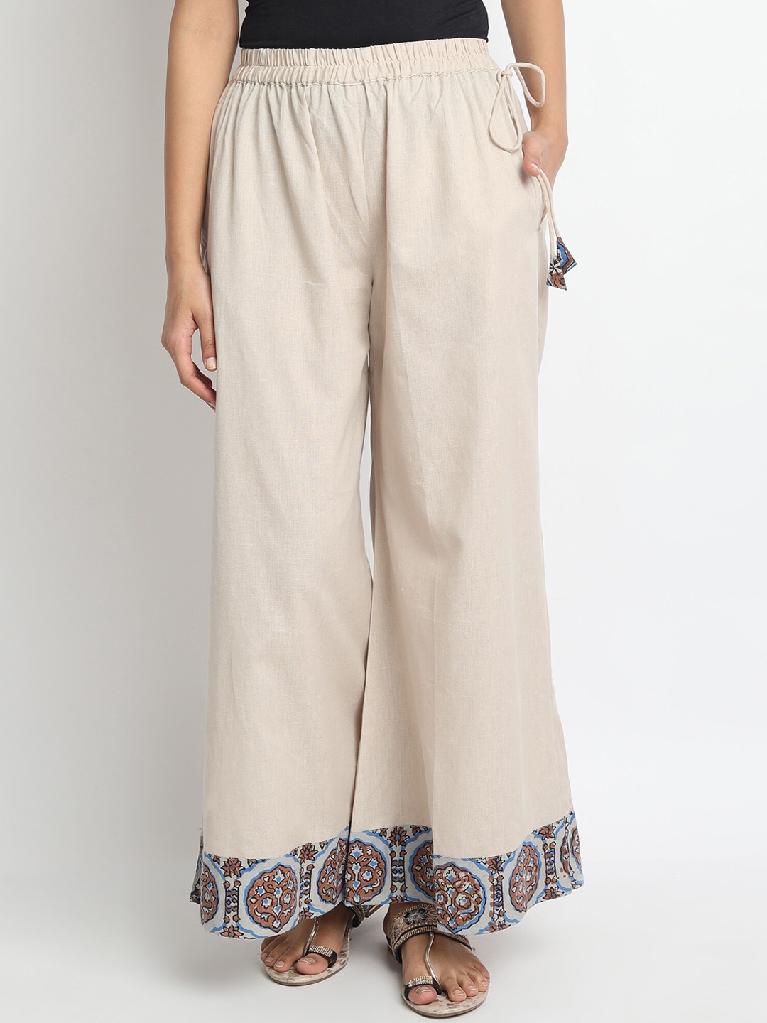 

Molcha Women Beige Floral Printed Flared Palazzos