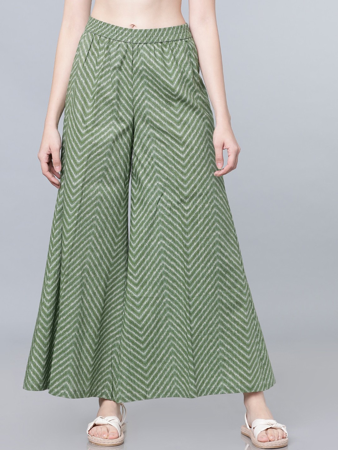 

Vishudh Women Green & White Striped Flared Palazzos