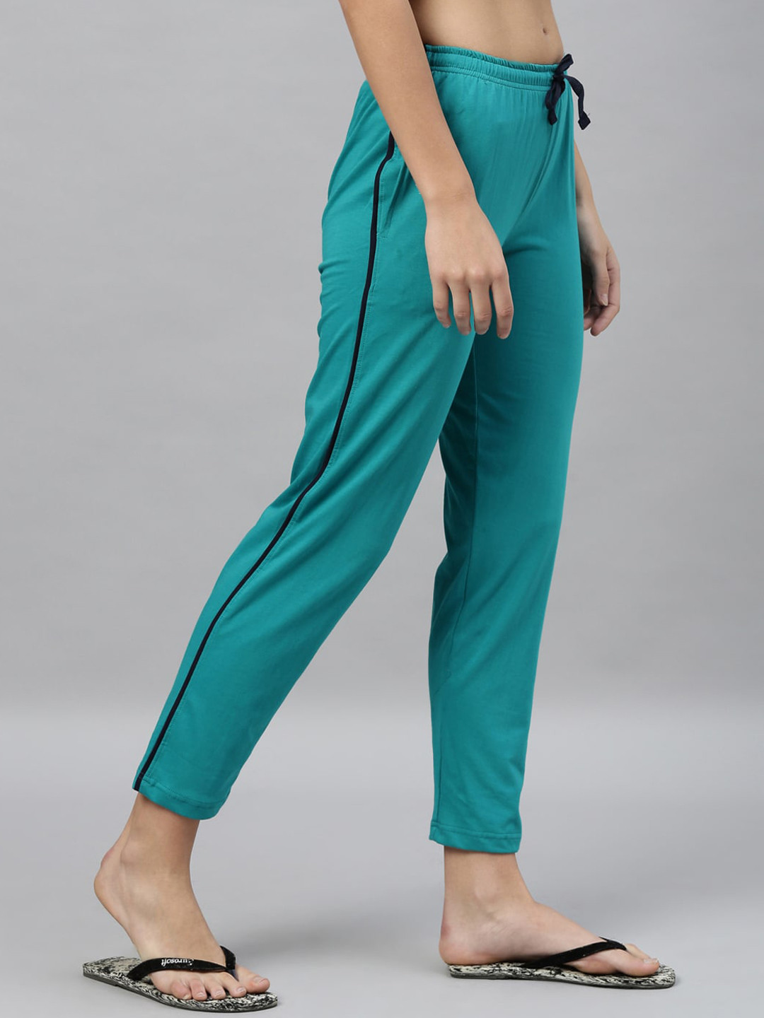 

Kryptic Women Green & Black Solid Lounge Pants