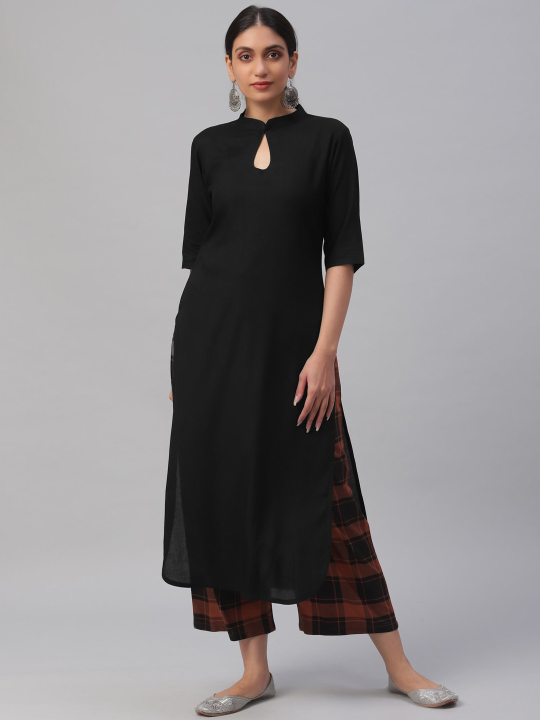 

Libas Women Black & Orange Solid Kurta with Trousers