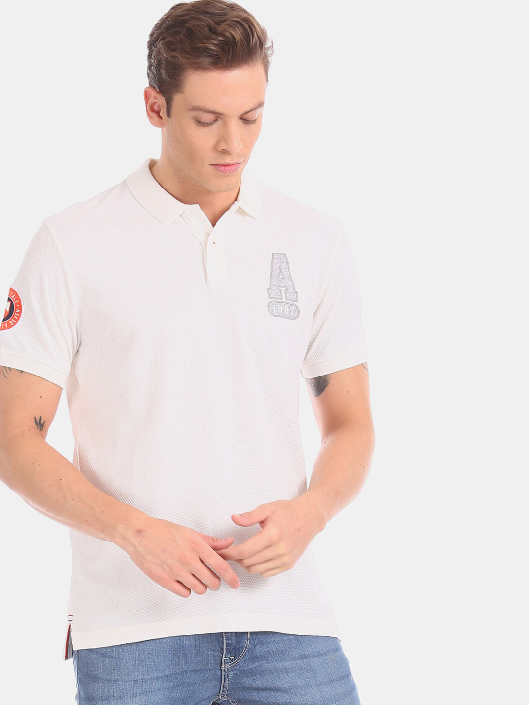 

Aeropostale Men White Solid Polo Collar T-shirt