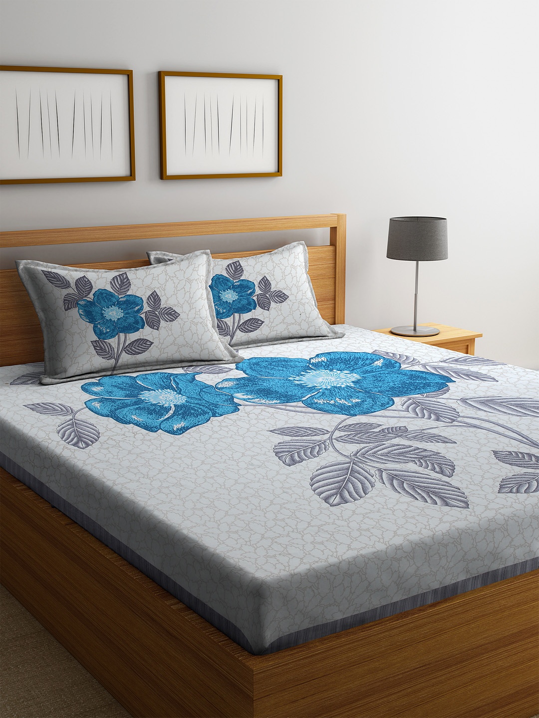 

Rajasthan Decor White & Turquoise Blue Floral 144 TC Cotton 1 King Bedsheet with 2 Pillow Covers