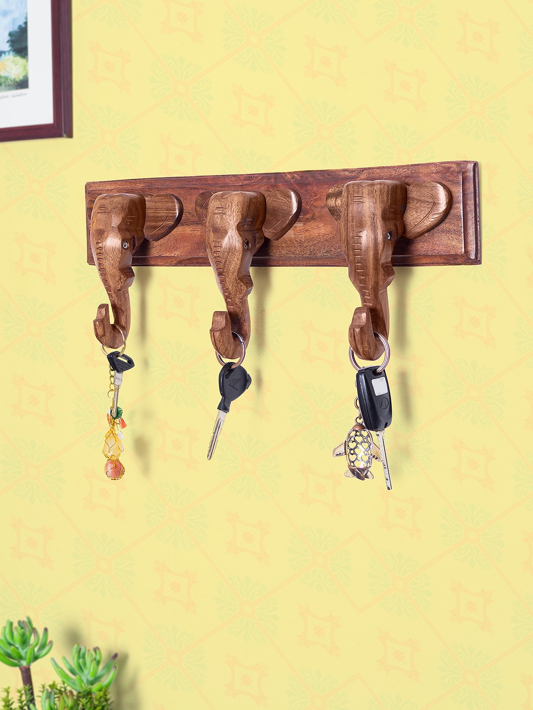 

Golden Peacock Brown Handcrafted Wooden Elephant Head Shaped Wall Decor