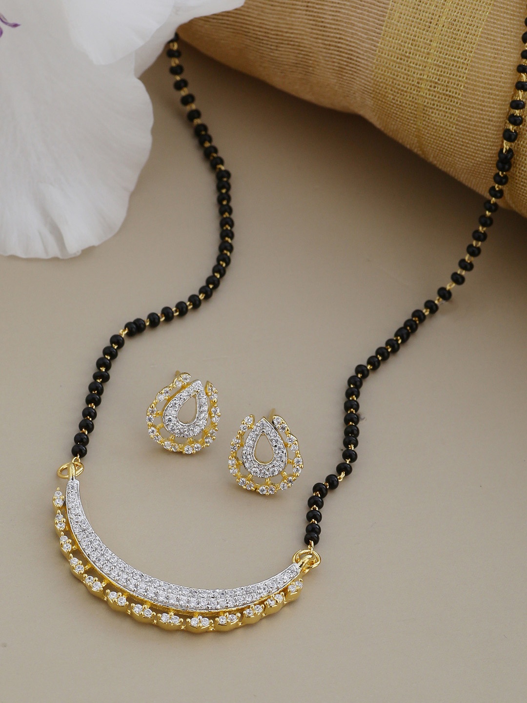 

Shoshaa Gold-Toned & Black Beaded AD-Studded Mangalsutra With Earrings