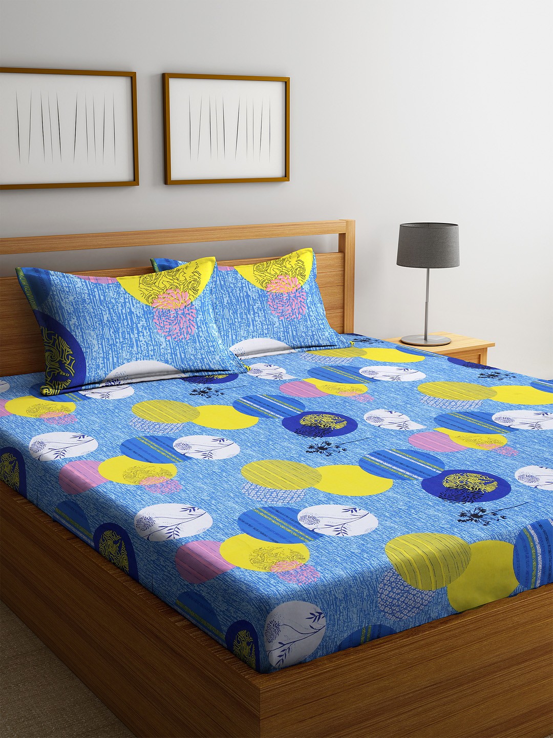 

Cortina Blue & Yellow Geometric 120 TC Cotton 1 Queen Bedsheet with 2 Pillow Covers