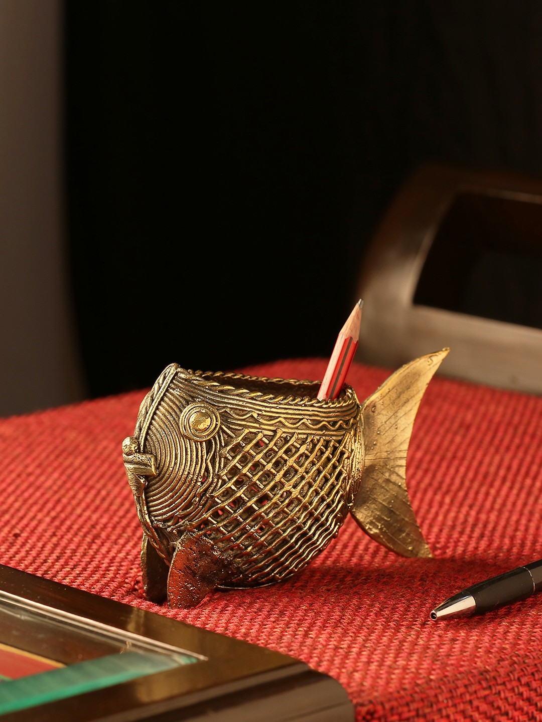 

ExclusiveLane Gold-Toned Brass Golden Fish Handmade Dhokra Art Pen Stand