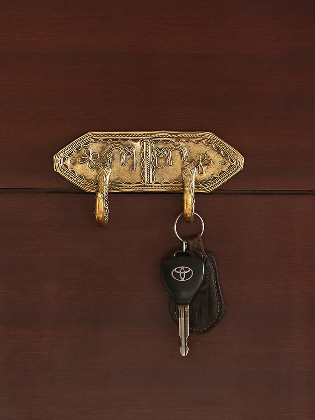 

ExclusiveLane Tribal Elephanta Hooks Brass Dhokra Art Handmade Towel Holder, Gold