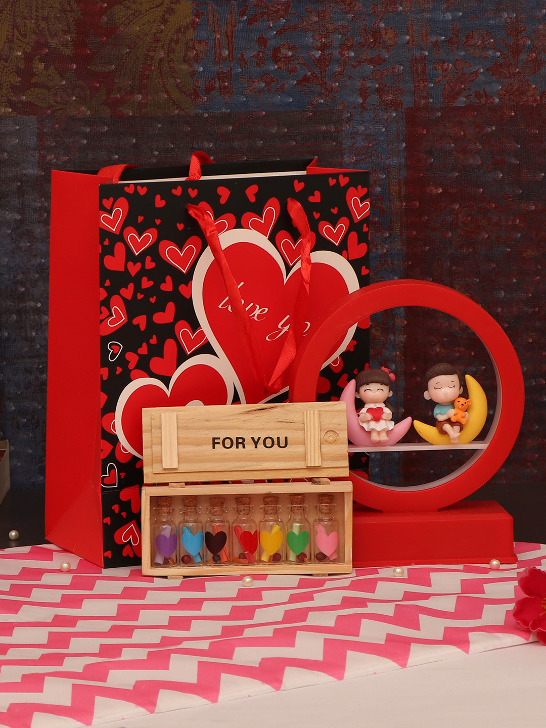 

Tied Ribbons Red & Black Couple Showpiece Led Lamp, Carry Bag and Love Messages Bottle