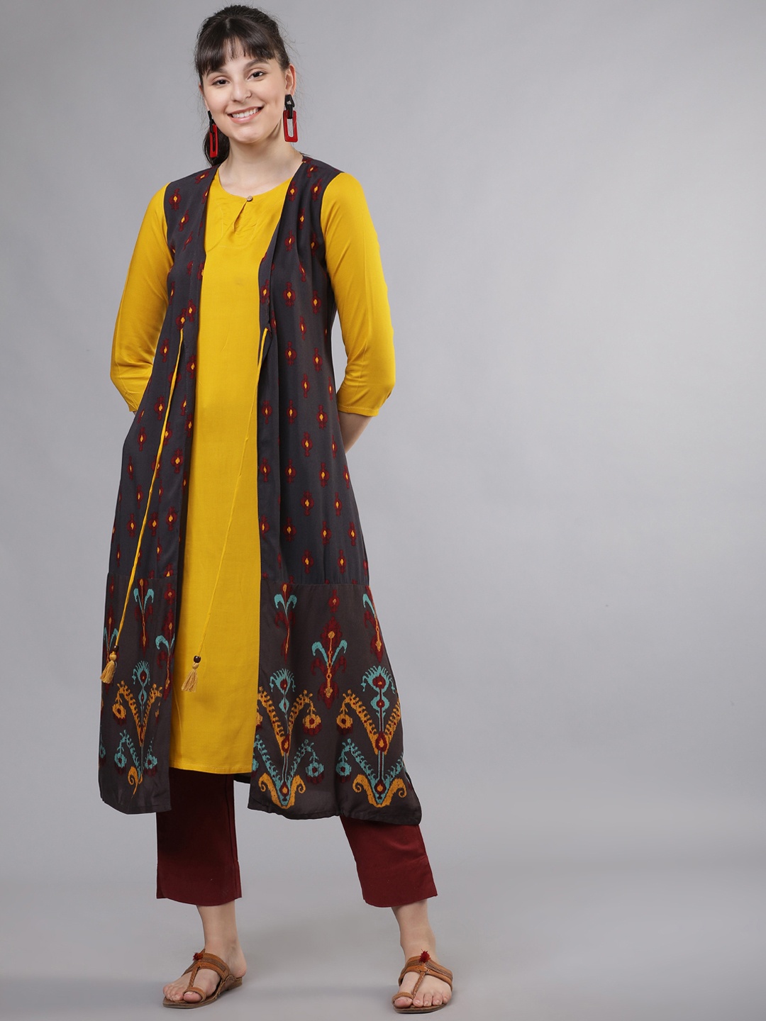

Vishudh Women Yellow Solid Layered Straight Kurta
