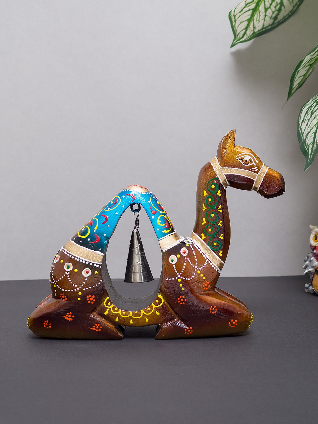 

Golden Peacock Brown & Blue Handmade Wooden Camel with Iron Bell Showpiece