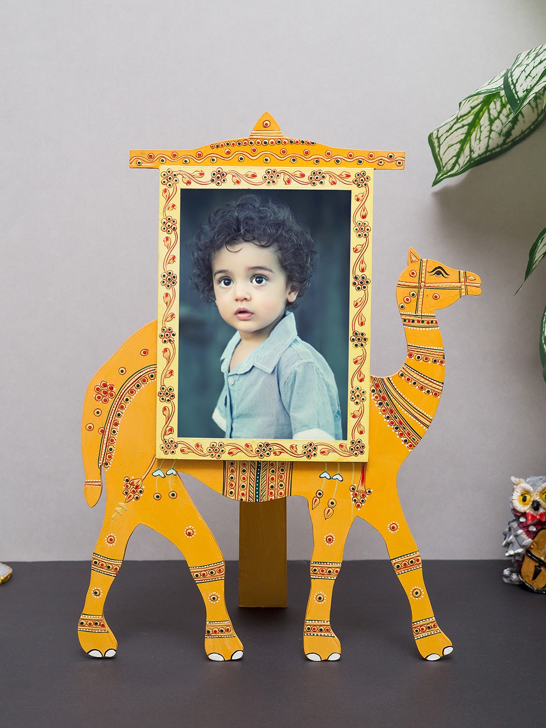 

Golden Peacock Yellow Hand-Painted Wooden Camel Shaped Photo Table-Top Frame