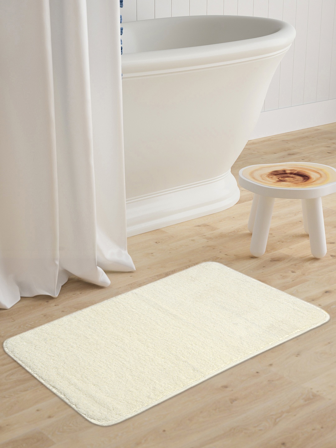 

Saral Home Off White Solid Microfibre Anti-Skid Bath Mat