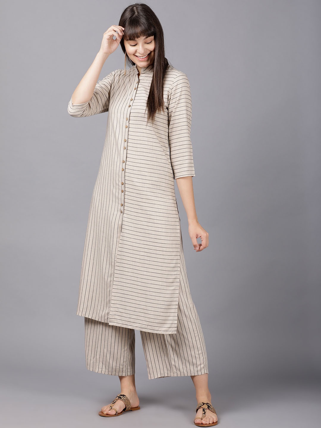 

Vishudh Women Taupe Striped Kurta with Palazzos