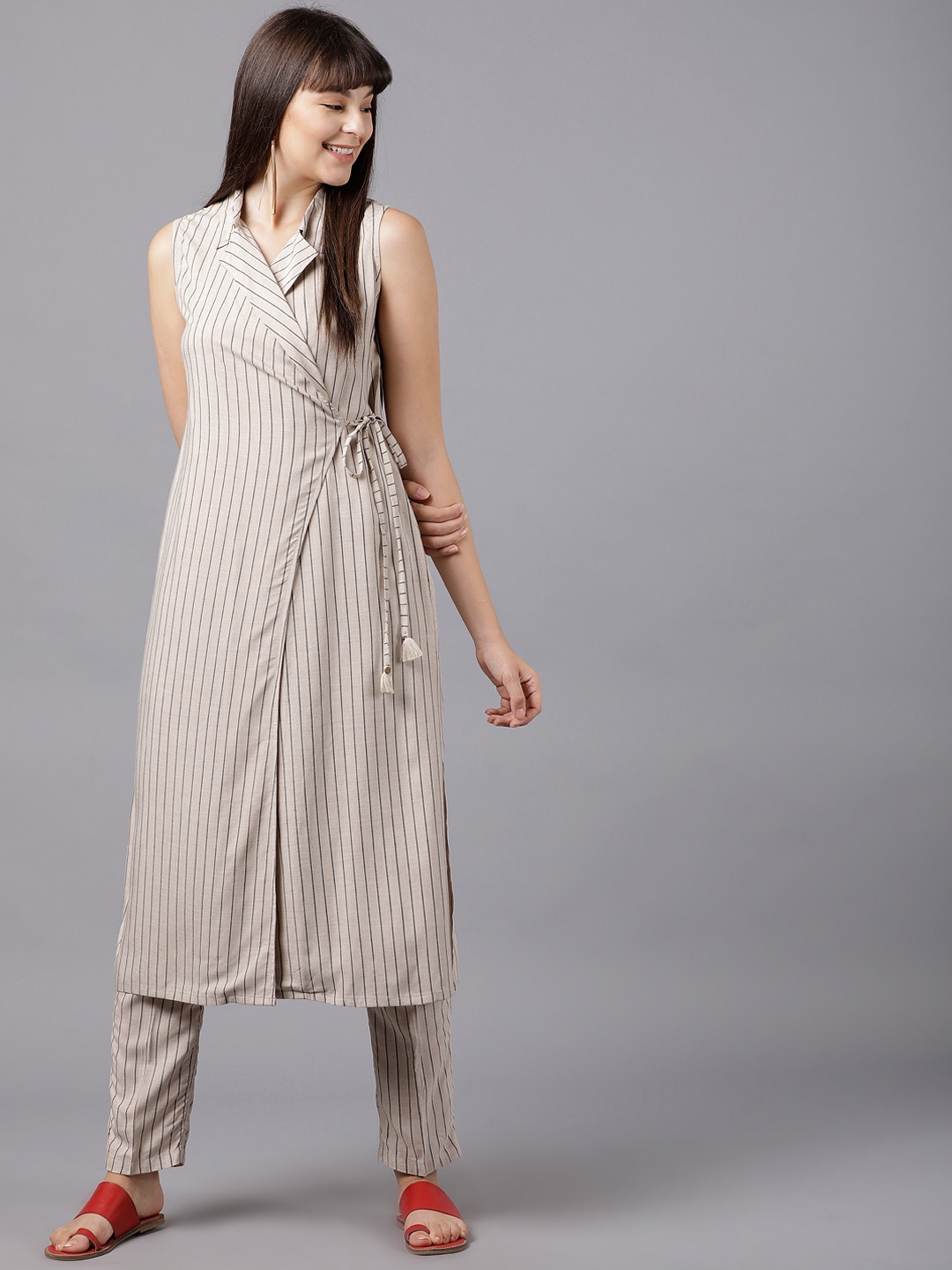 

Vishudh Women Beige Striped Kurta with Trousers