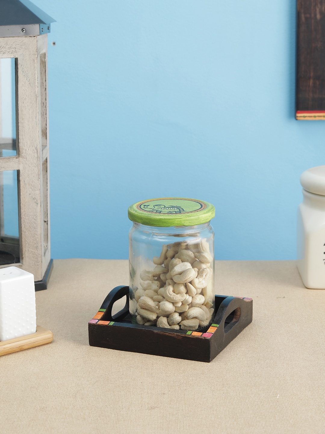 

VarEesha Transparent & Green Madhubani Hand-Painted Lid Glass Jar With Brown Mango Wood Tray