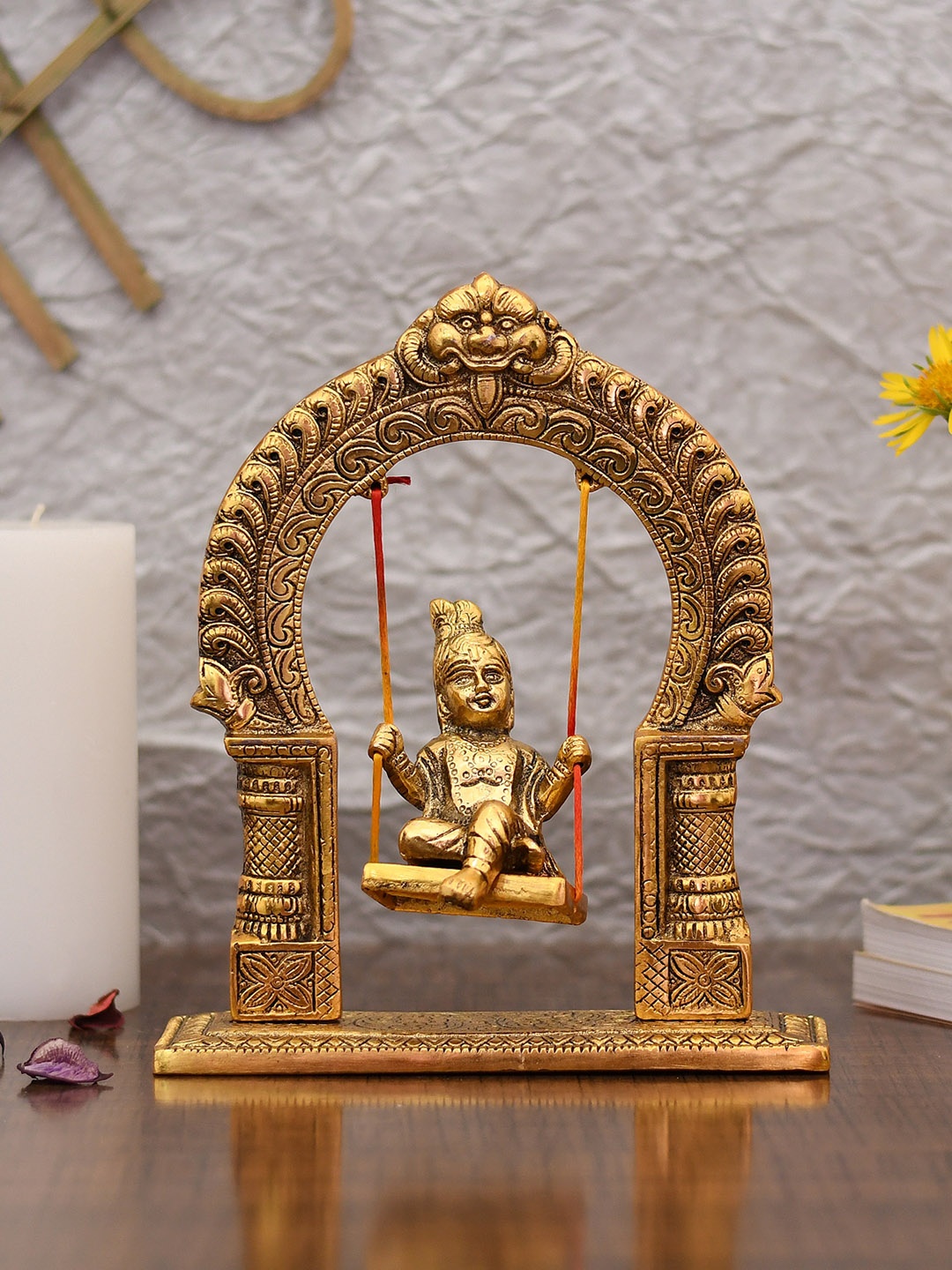 

CraftVatika Gold-Toned Baby Krishna On Jhula Showpiece