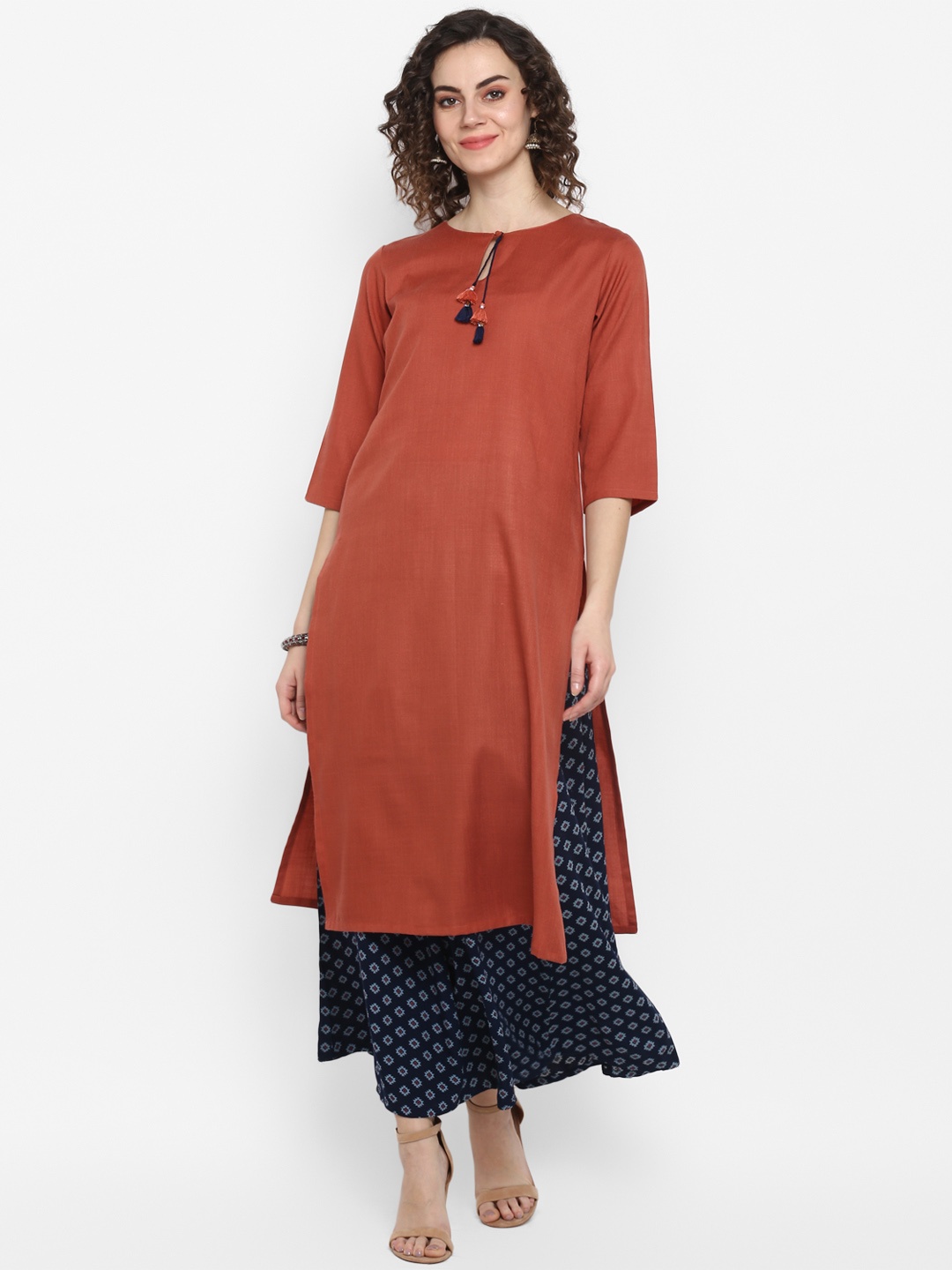 

Janasya Women Rust Red & Blue Solid Kurta with Palazzos