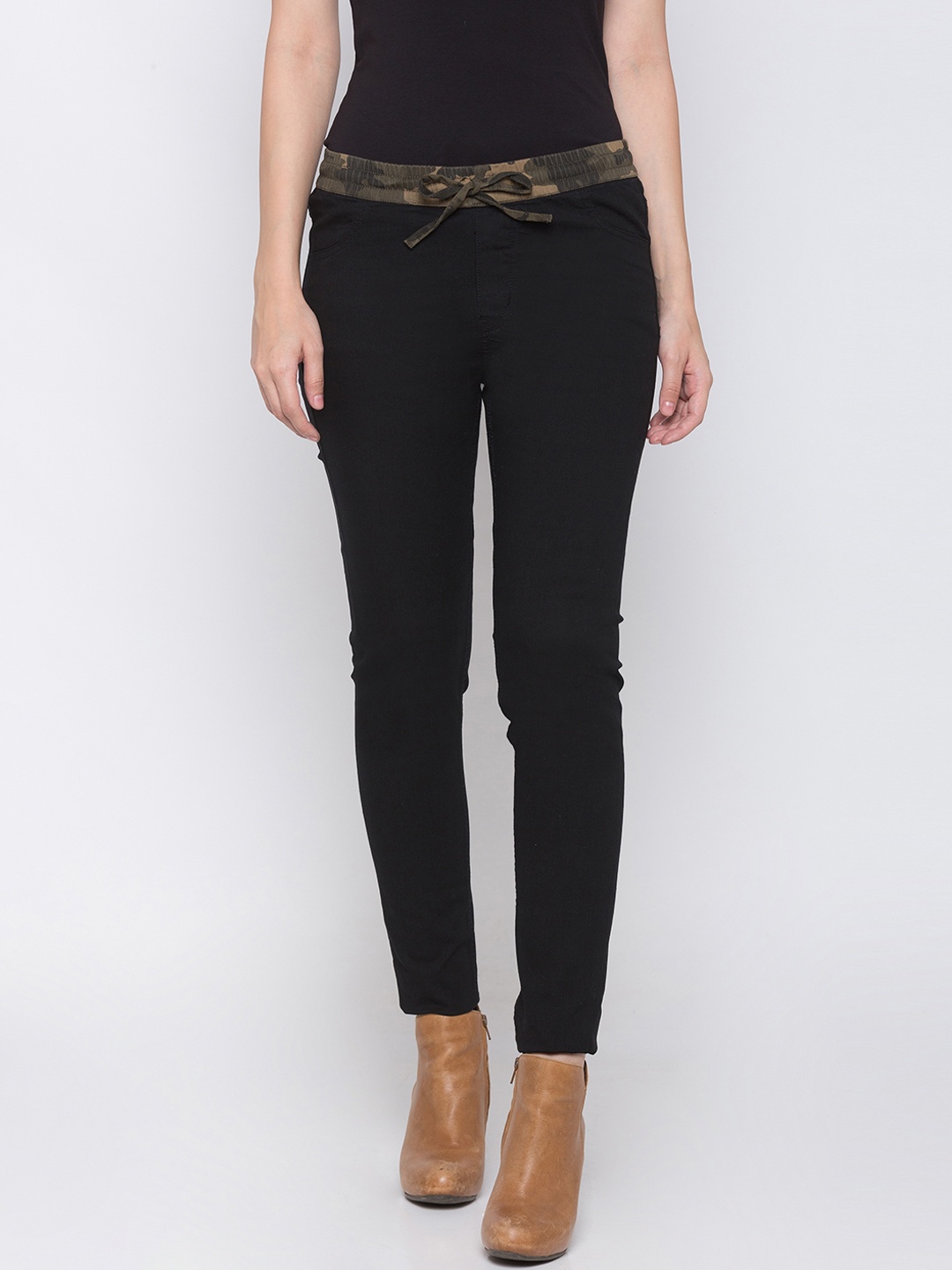 

Globus Women Black Solid Regular Trousers