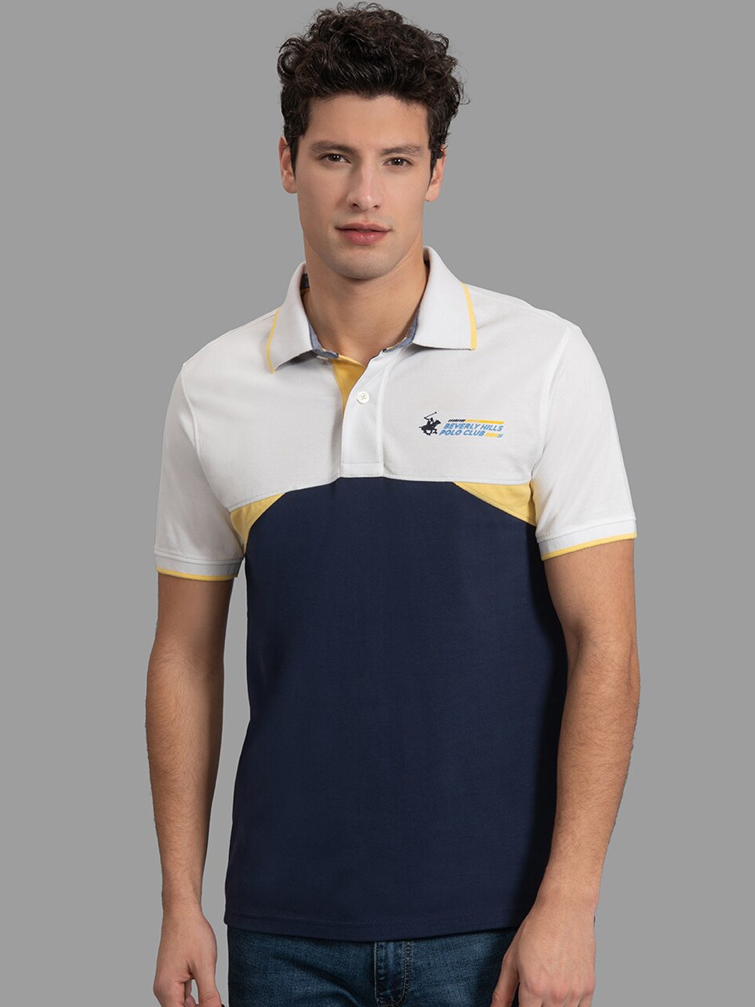 

Beverly Hills Polo Club Men White & Navy Blue Colourblocked Polo Collar T-shirt