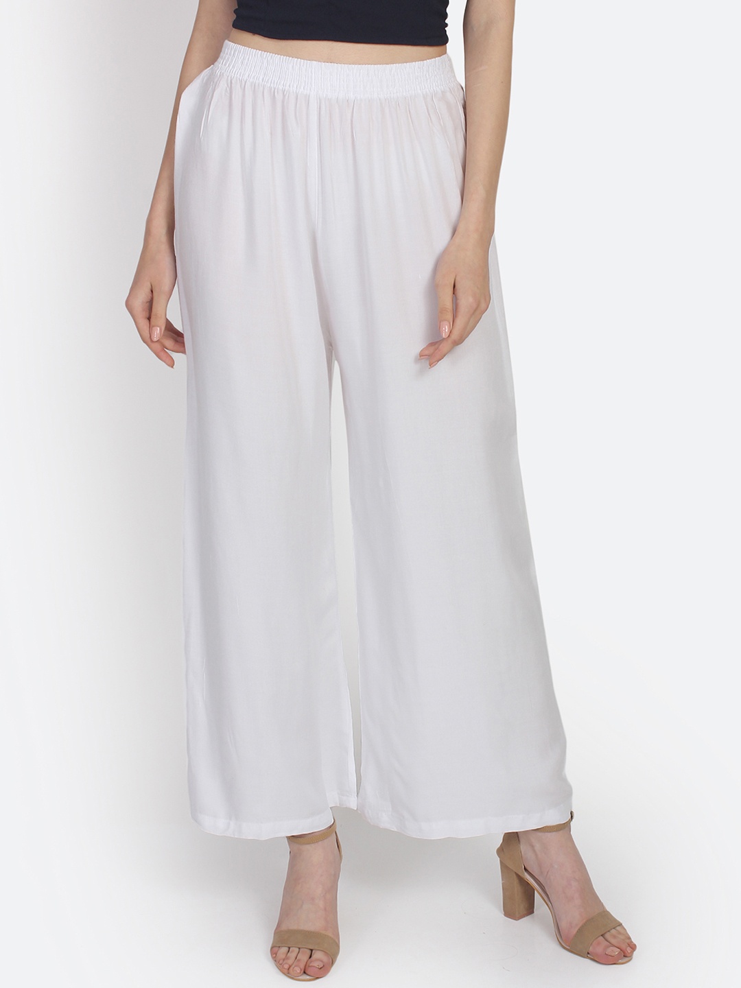 

Anekaant Women White Solid Flared Palazzos
