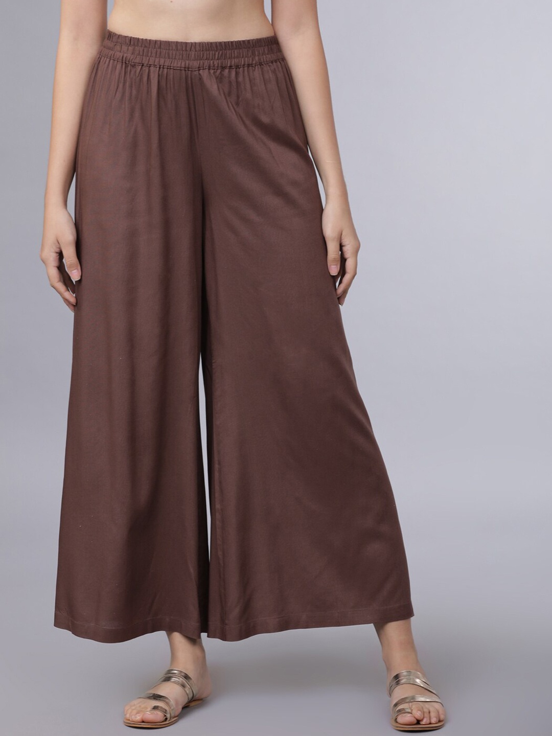 

Vishudh Women Brown Solid Flared Palazzos