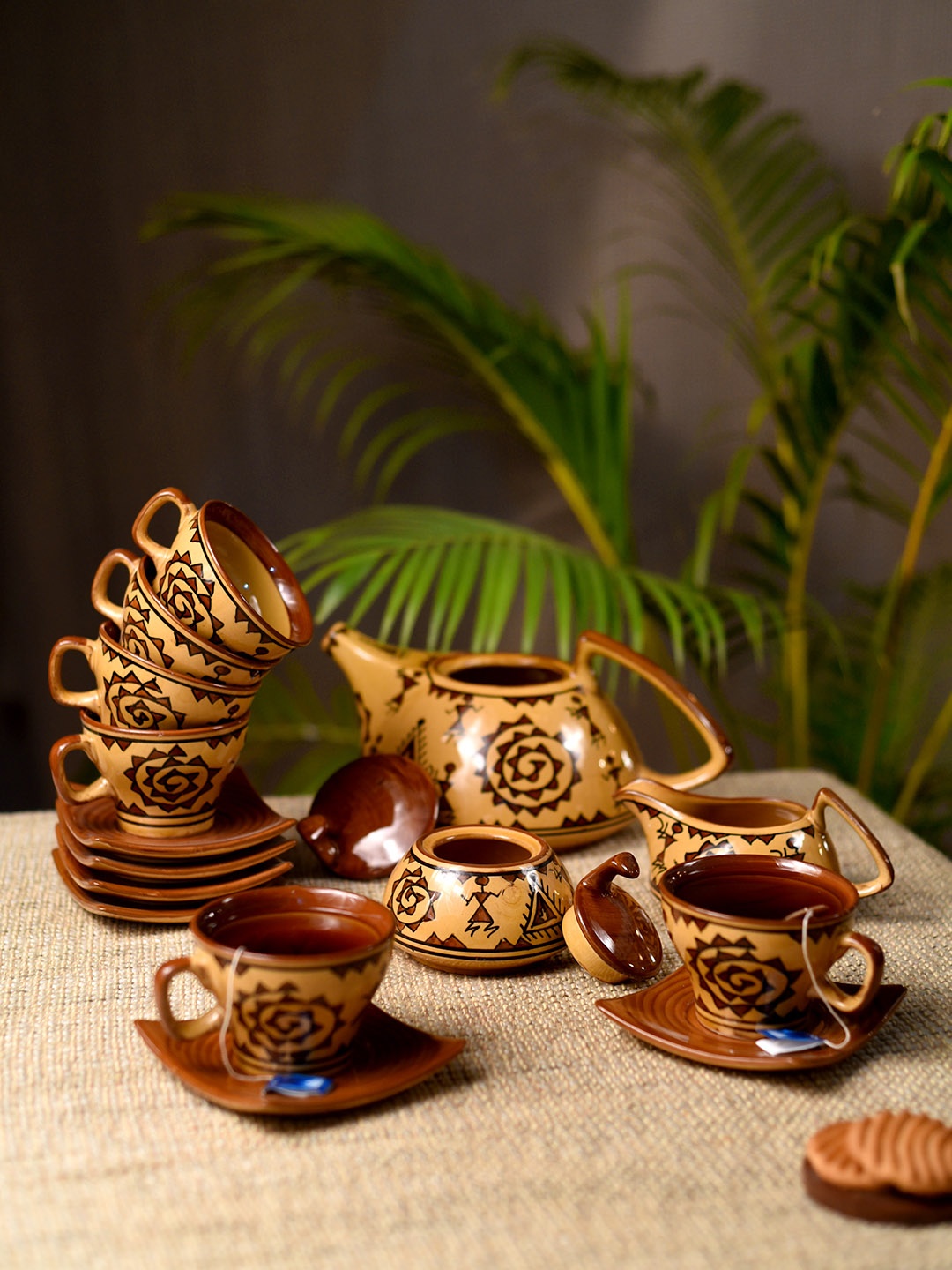 Unravel India Yellow & Brown Warli Handpainted Stoneware 15 Pieces Tea Set