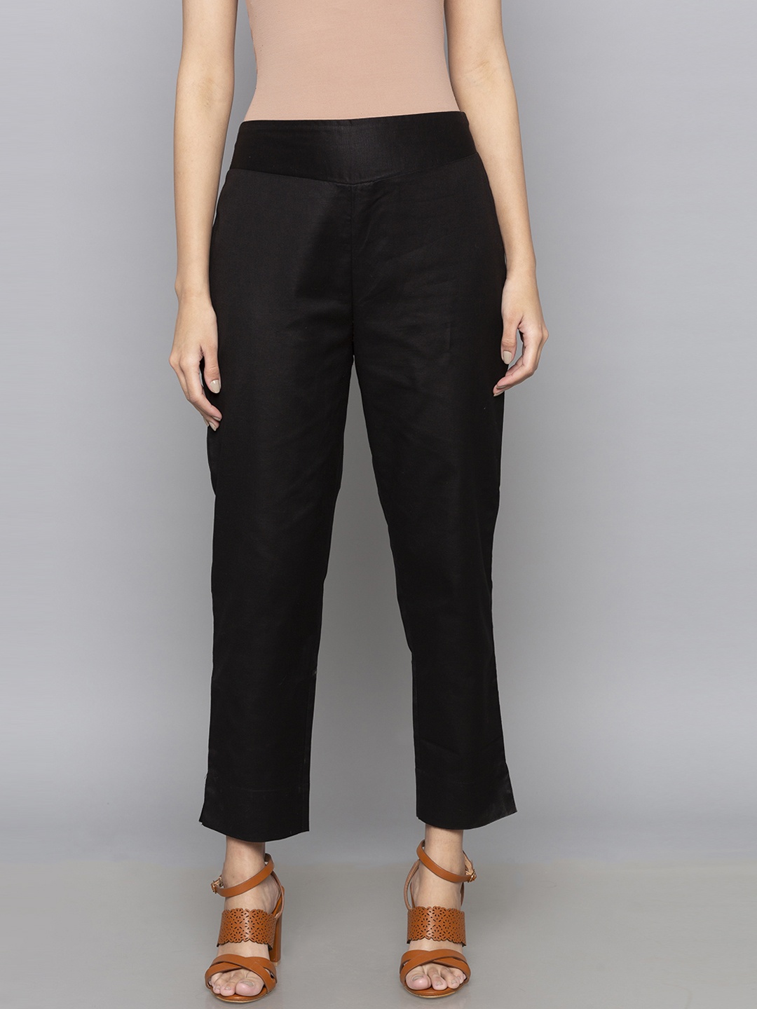 

Desi Weavess Women Black Solid Regular Trousers