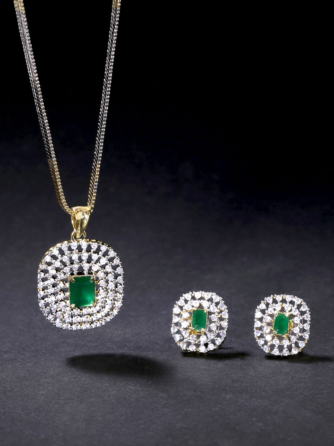 

Yellow Chimes Gold Plated White & Green AD & Emerald -Studded Oval Pendant & Earrings Set