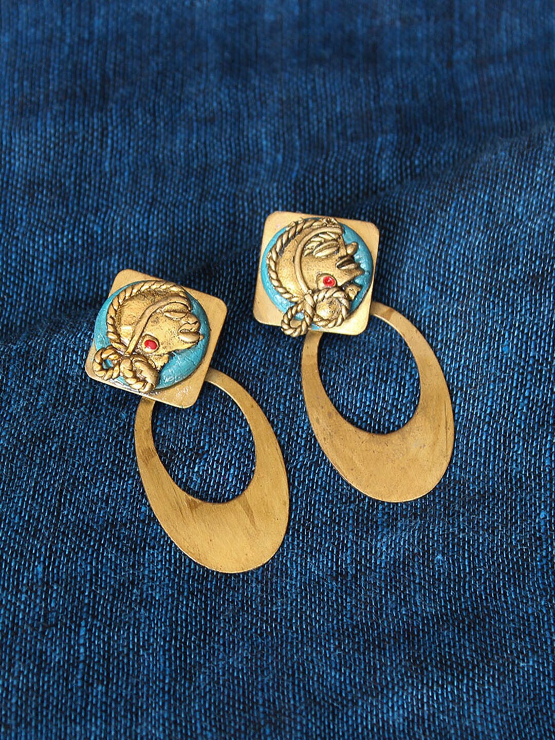 

ExclusiveLane Tribal Girl Faces Bohemian Dhokra Art Handcrafted Earrings, Gold