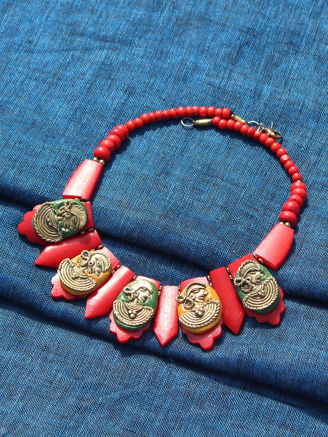 

ExclusiveLane Tribal Women Faces Handcrafted Dhokra Art Bohemian Necklace, Gold