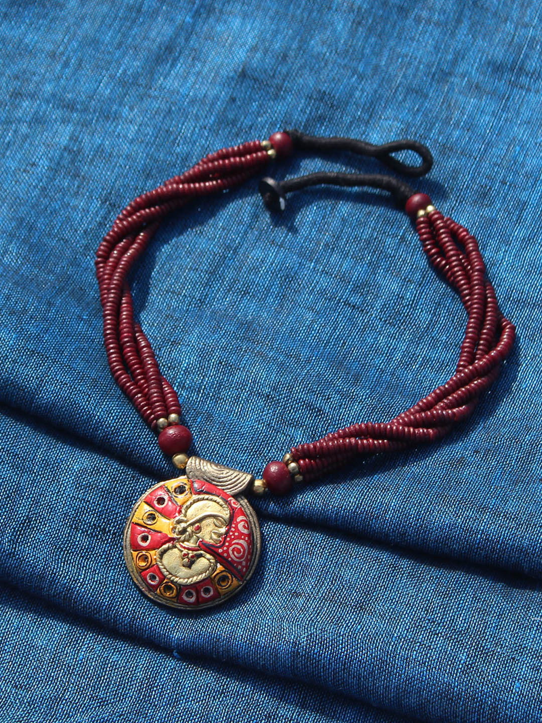 

ExclusiveLane Gold-Toned & Maroon Handcrafted Beaded Dhokra Art Brass Necklace