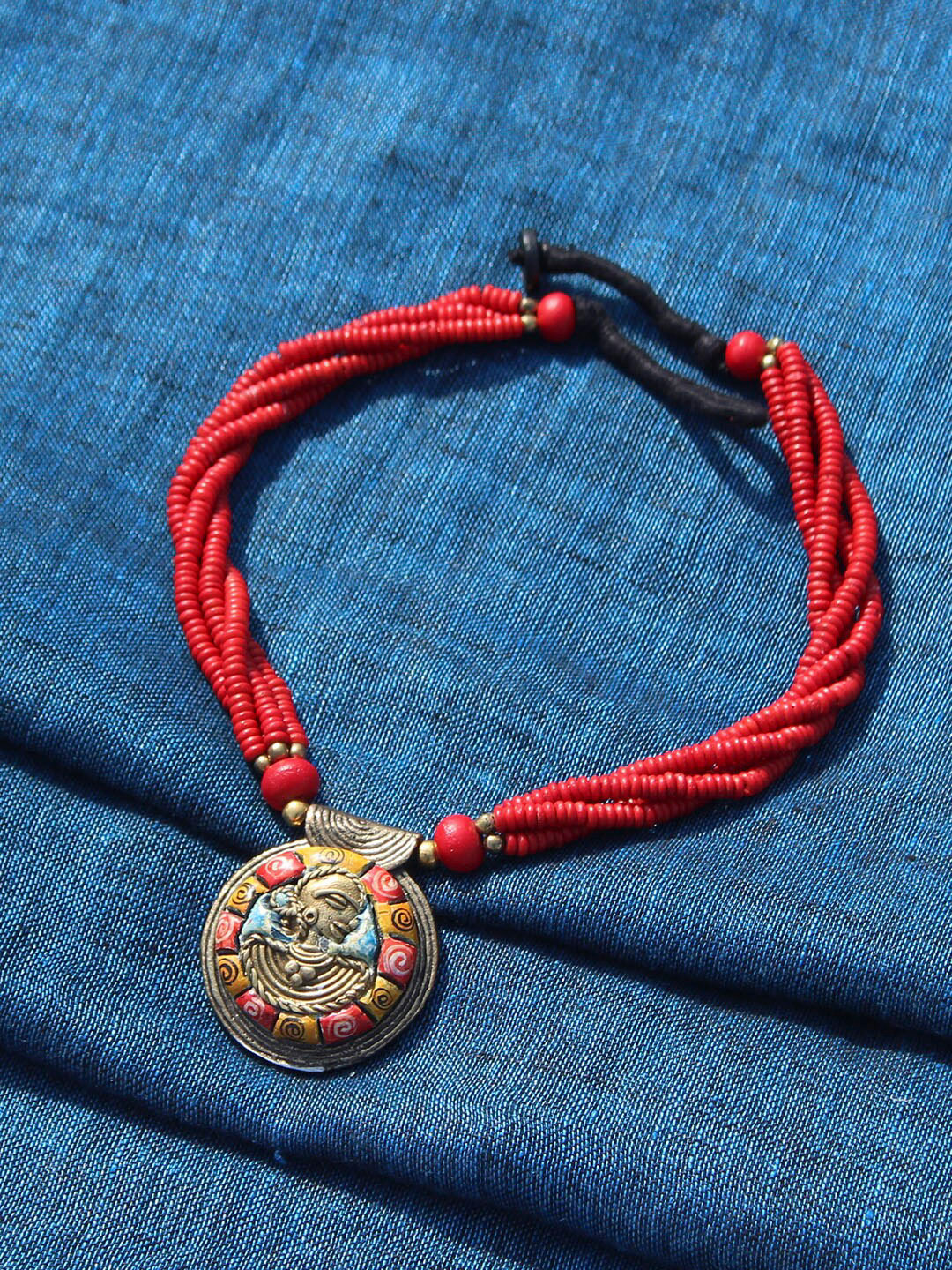 

ExclusiveLane Gold-Toned Tribal Woman Strands Dhokra Art Handcrafted Brass Necklace