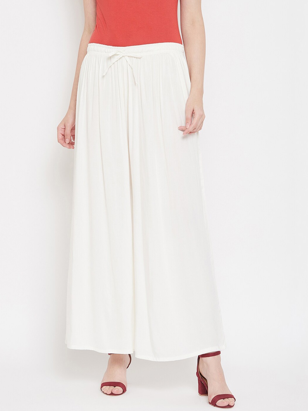 

Castle Women Off-White Solid Flared Palazzos