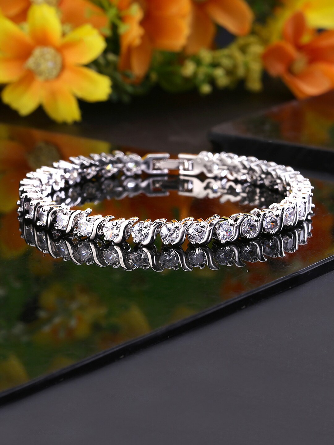 

Yellow Chimes Silver-Toned White Crystals Stoned Bracelets