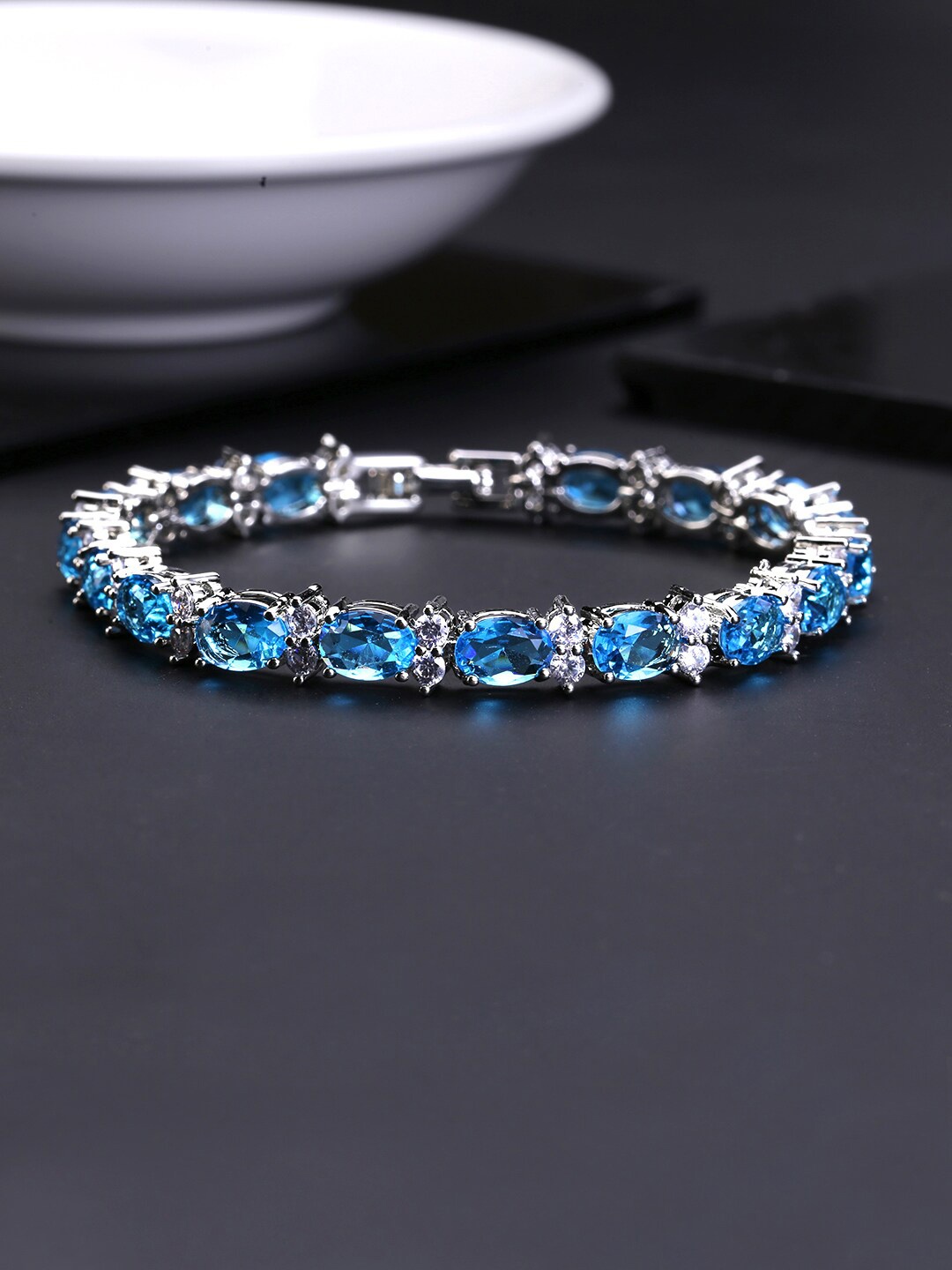 

Yellow Chimes Women Blur Crystal Studded Bracelets, Blue