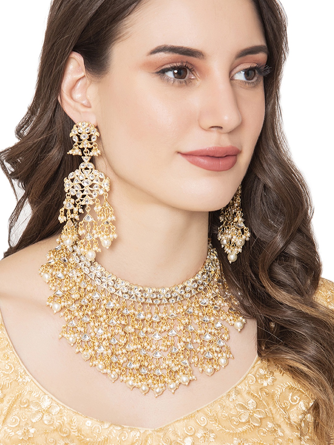 

Shoshaa Gold-Plated White Kundan & Pearl Beaded Heavy Tasseled Jewellery Set