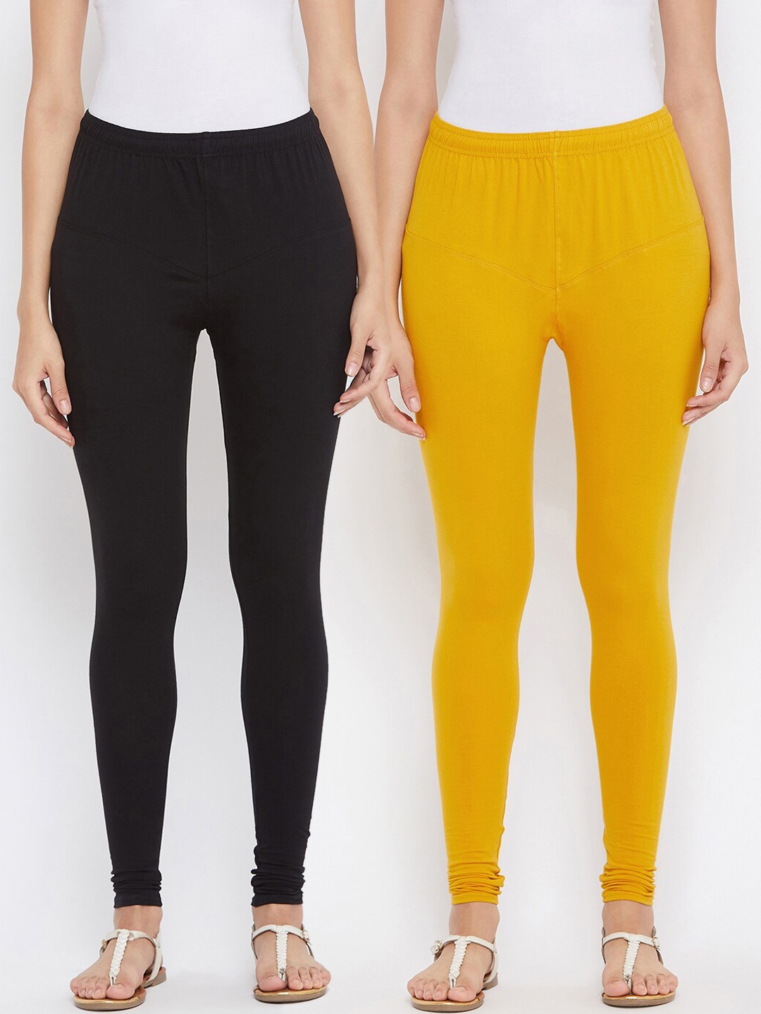 

Tulsattva Women Pack Of 2 Black & Yellow Solid Churidar-Length Leggings