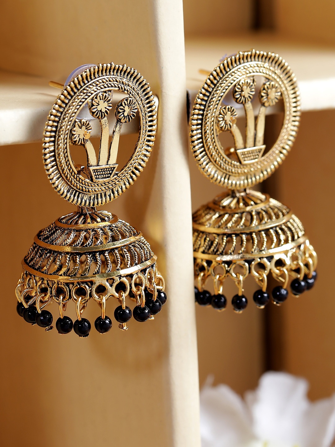 ANIKAS CREATION Gold-Toned & Black Dome Shaped Jhumkas