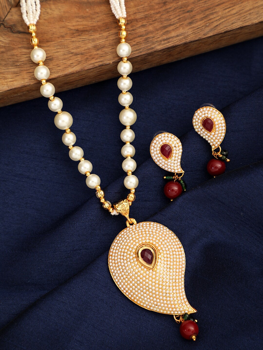 

ANIKAS CREATION Gold-Plated Off-White & Red Stone-Studded Pearl Handcrafted Jewellery Set